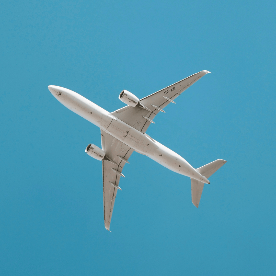 Airplane flying against a clear blue sky
