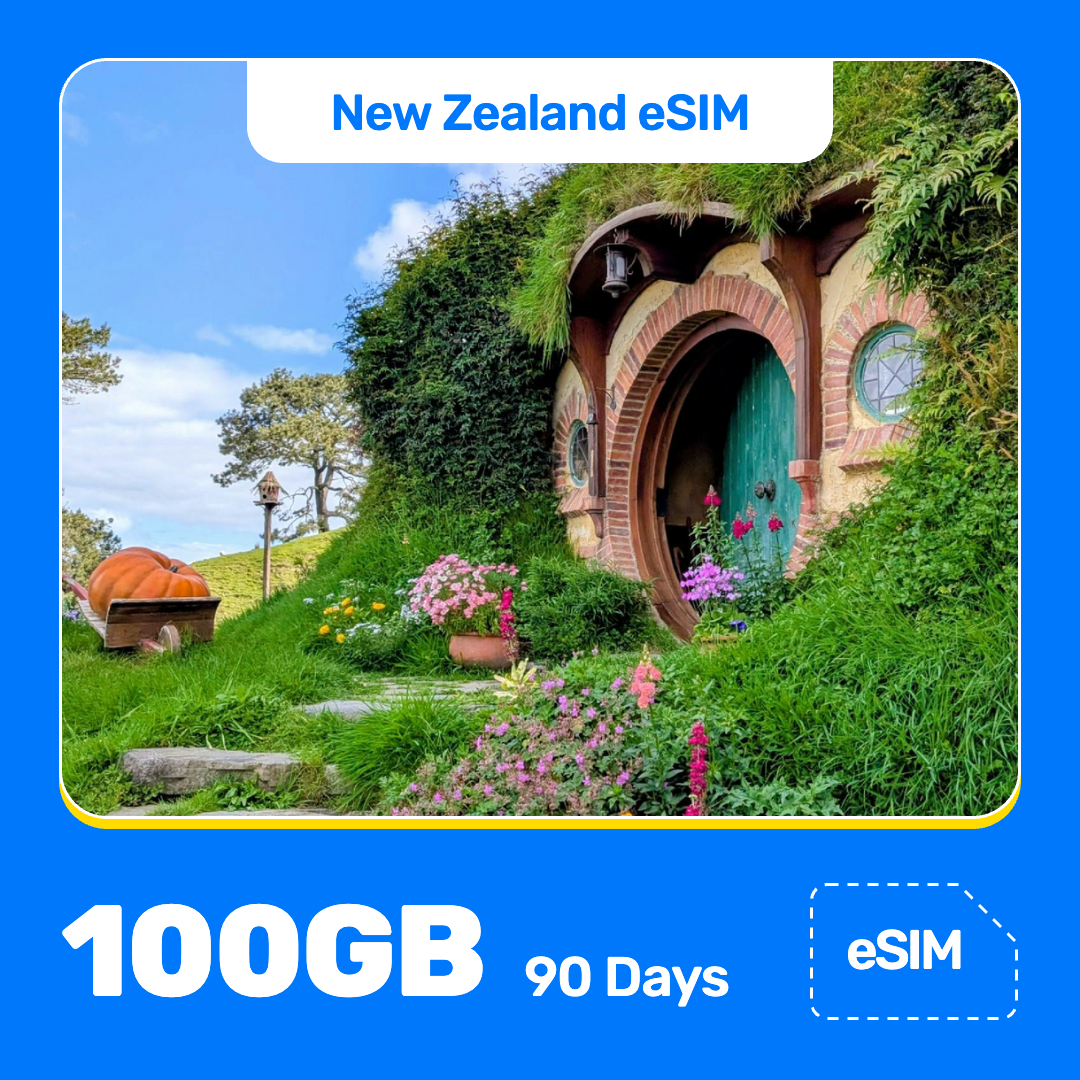 New Zealand eSIM product banner featuring the Hobbit-hole doorway set into a flower-covered hillside, with a large pumpkin nearby, on a bright sunny day at the Hobbiton Movie Set. Blue “New Zealand eSIM” text appears at the top, with large white “100GB for 90 Days” text at the bottom left and an “eSIM” label at the bottom right.