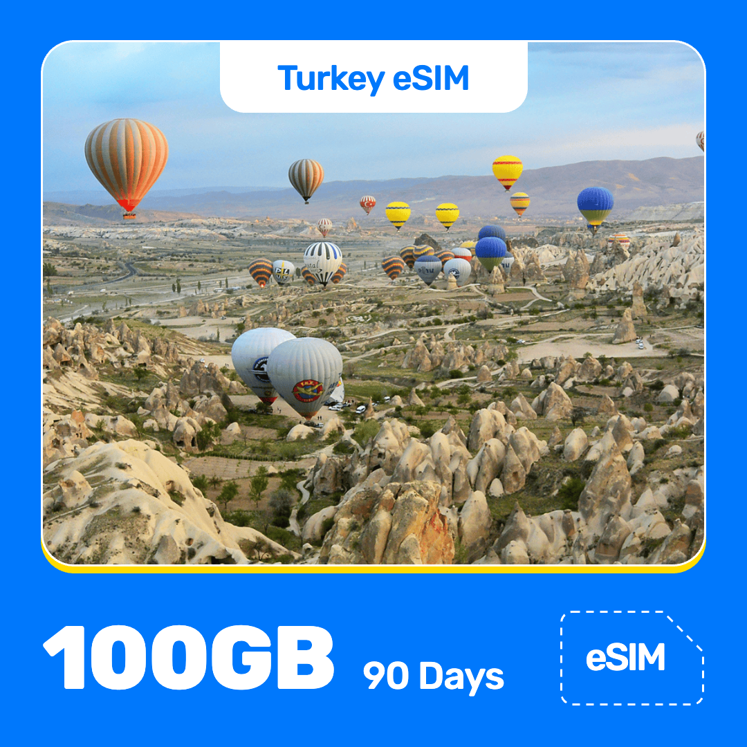 Turkey eSIM product banner featuring a colorful hot-air balloons float over the rocky landscape of Cappadocia, Turkey, under a bright sky, with hills stretching into the distance. Blue “Turkey eSIM” text appears at the top, with large white “100GB for 90 Days” text at the bottom left and an “eSIM” label at the bottom right.