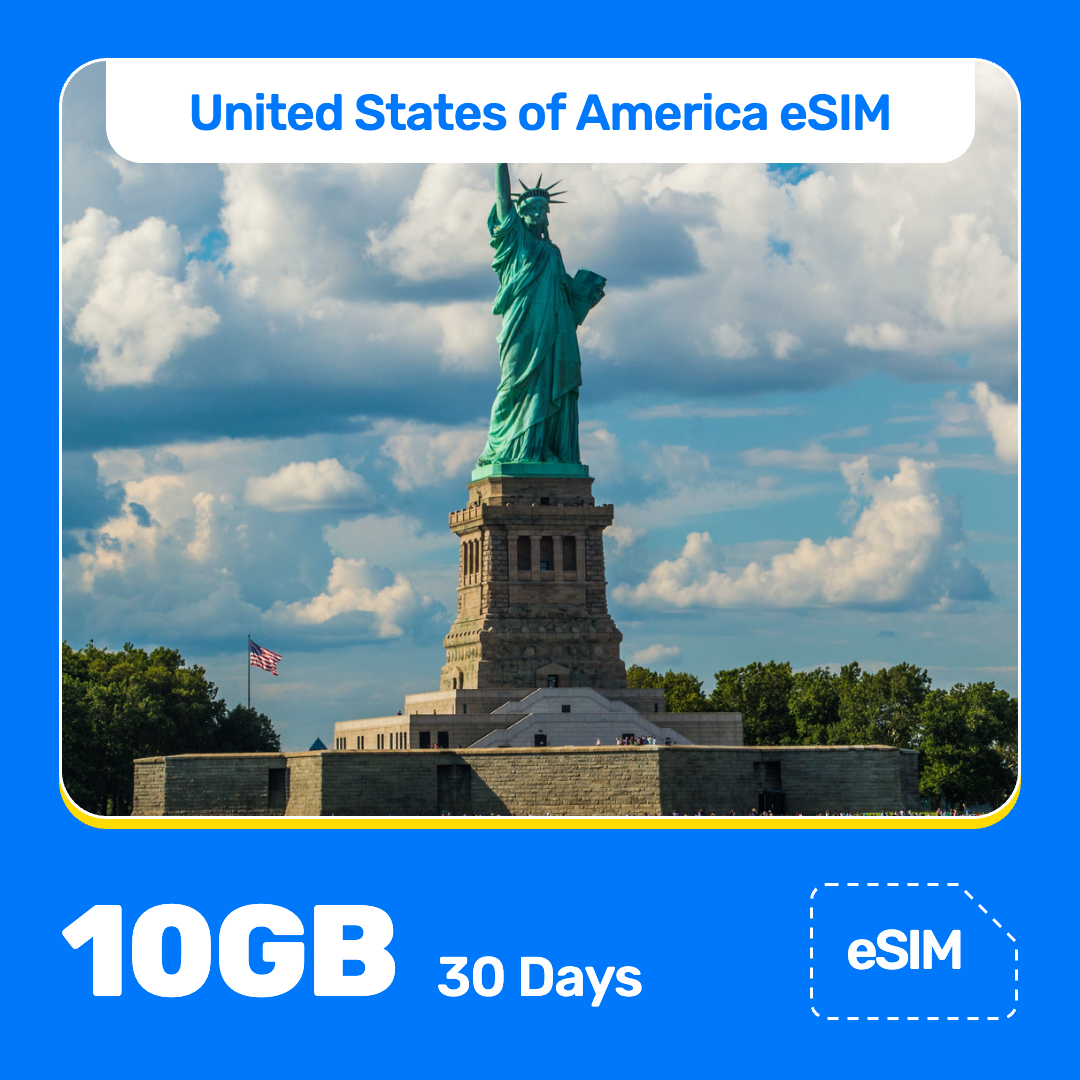 USA eSIM product banner featuring the Statue of Liberty on an island in New York Harbor on a sunny day, with visitors along the shore, and American flag nearby. Blue “USA eSIM” text appears at the top, with large white “10GB for 30 Days” text at the bottom left and an “eSIM” label at the bottom right.