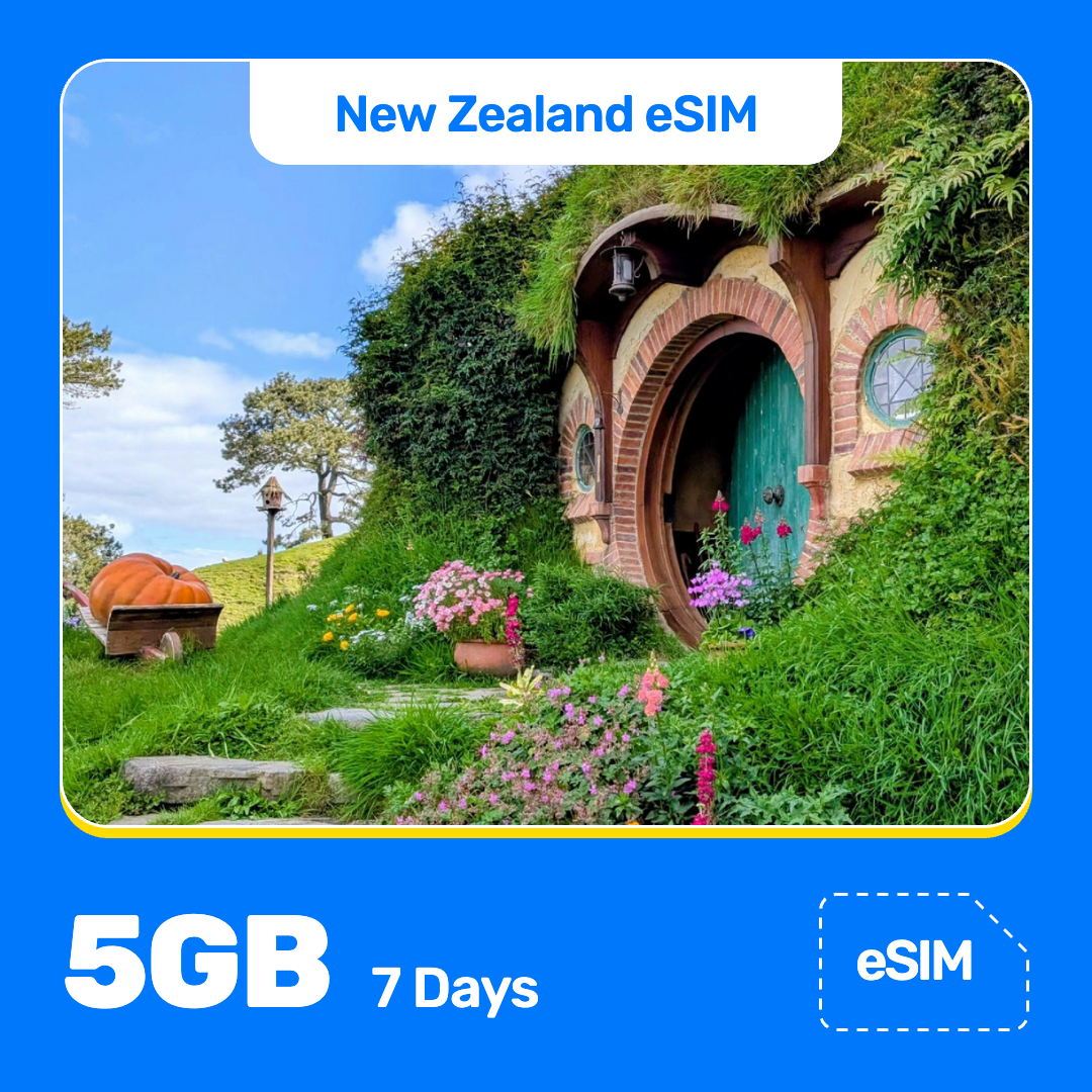 New Zealand eSIM product banner featuring the Hobbit-hole doorway set into a flower-covered hillside, with a large pumpkin nearby, on a bright sunny day at the Hobbiton Movie Set. Blue “New Zealand eSIM” text appears at the top, with large white “5GB for 7 Days” text at the bottom left and an “eSIM” label at the bottom right.