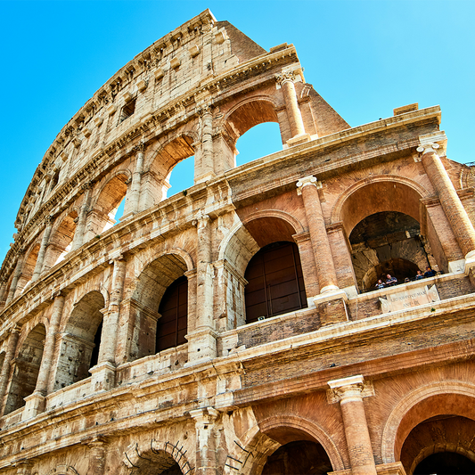 Colosseum in Rome against a clear blue sky